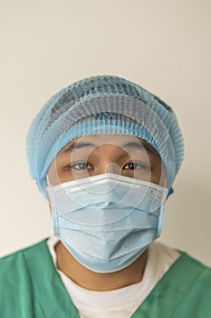 Close up portrait of Tired doctor at the hospital. A doctor, a nurse who is thinking about treating a disease and a pandemic.