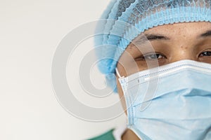 Close up portrait of Tired doctor at the hospital. A doctor, a nurse who is thinking about treating a disease and a pandemic.