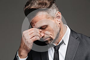 Close up portrait of a tired mature businessman