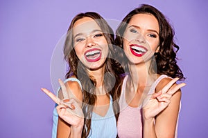 Close up portrait two curly stunning beautiful she her lady excited sisters bright pomade suits white teeth show v-sign