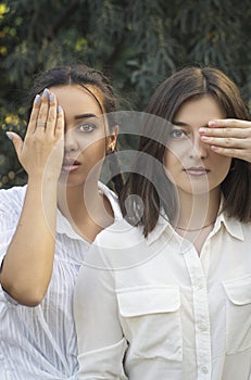 Close-up portrait of two girls. Protecting same-sex relationships. Feminism. Struggle for women`s rights