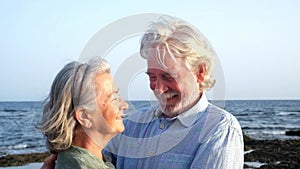 close up and portrait of two happy and active seniors or pensioners having fun and enjoying looking at the camera smiling with the