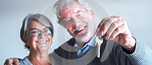 Close up and portrait of two seniors or mature people buying a new house or car or some property - independent lifesyle and