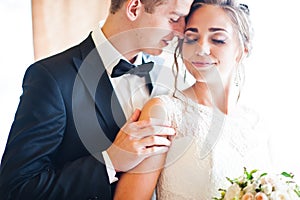 Close up portrait of wedding couple at gentle touch