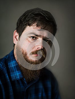 Close-up portrait of a white bearded man