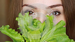 Close up portrait woman eating green salad. Healthy food, vegetarian, vegan, raw food, diet.