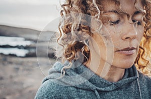 Close up portrait of woman face with closed eyes. Feeling and sensations concept. Female people in meditation od mindfulness