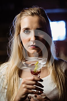 Close up portrait of woman with martini glass