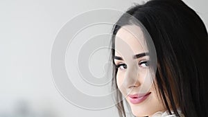 Close up portrait of woman turn around with windy hair long eyelashes