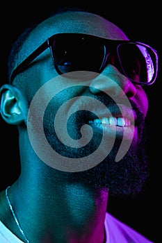 Close up portrait of a young african man indoors