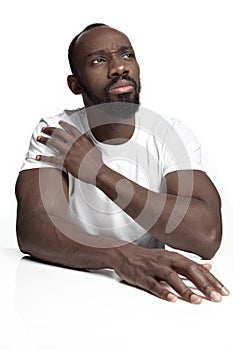 Close up portrait of a young african man indoors