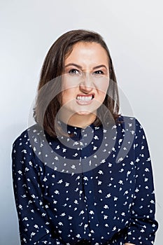 Close up portrait of young annoyed Frustrated And Angry woman. Negative human emotions, face expressions.