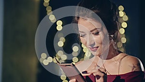 Close up portrait of young asian girl browsing as or social media posts alone. Woman surfing internet on smartphone or