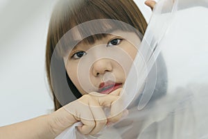 Close up portrait of young asian thai black short hair woman covered with white cloth fabric silk