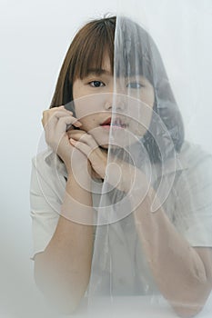 Close up portrait of young asian thai black short hair woman covered with white cloth fabric silk