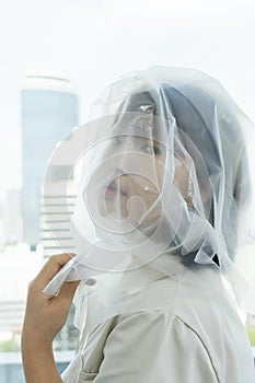 Close up portrait of young asian thai black short hair woman covered with white cloth fabric silk