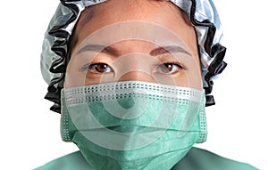 Close up portrait of young attractive and confident Asian Korean medicine doctor woman in head cap face mask and scrubs in