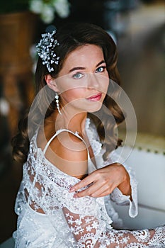 Close-up portrait of young beautiful bride preparing to wedding ceremony