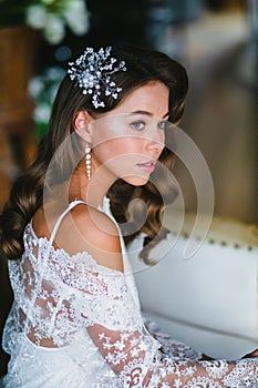 Close-up portrait of young beautiful bride preparing to wedding ceremony