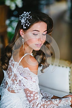 Close-up portrait of young beautiful bride preparing to wedding ceremony