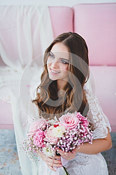 Close-up portrait of young beautiful bride with spring bridal bouquet