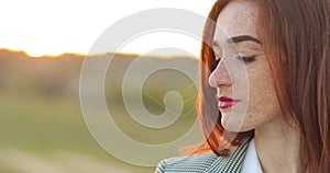 Close up portrait of young beautiful fashionable redhead woman with freckles, with brown eyes. beautiful red haired girl