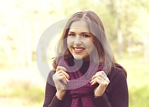 Close-up portrait of a young, beautiful and happy woman in fores