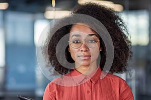 Close up portrait of young beautiful successful business woman, hispanic woman serious confident looking at camera close