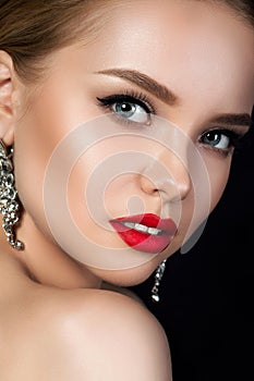 Close up portrait of young beautiful woman with red lips
