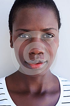 Close up beautiful young african woman face with serious expression