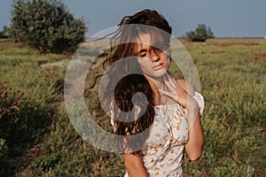 Close-up. Portrait of a young Caucasian woman, among the priors in a picturesque steppe boundless landscape. Autumn or