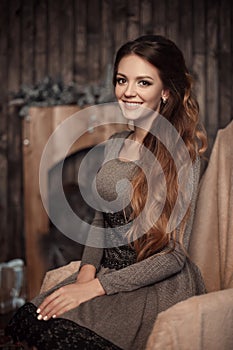 Close up portrait of young cheerful beautiful girl with dark lon