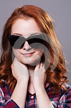 Close-up portrait of a young girl in sunglasses