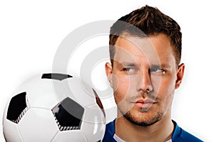 Close-up portrait of young handsome football player soccer posing on white isolated.