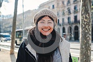 Close up portrait of young happy asian woman with beanie hat looking at camera with joyful attitude. Front view of girl