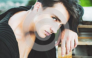 Close up portrait of young man. Sexy handsome male model. Beautiful eyes.