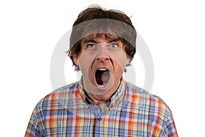 Close up portrait of young man yelling with open mouth photo