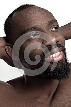 Close up portrait of a young naked african man indoors