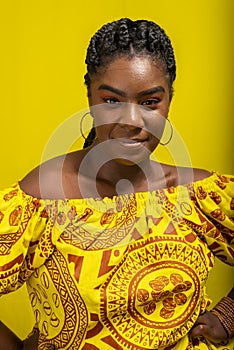 Close-up portrait of young, serious, beautiful woman, looking at camera