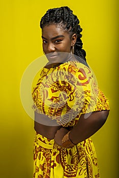 Close-up portrait of young, serious, beautiful woman, looking at camera