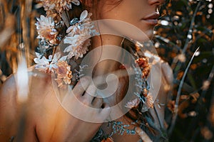 Close up portrait of young and tender woman on a feild at sunset