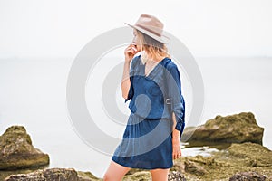 Close up portrait of young woman in brown hat outdoor.having fun on the sea