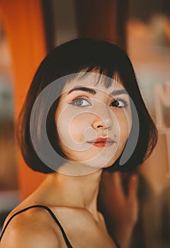 Close-up portrait of a young woman captured in soft natural light