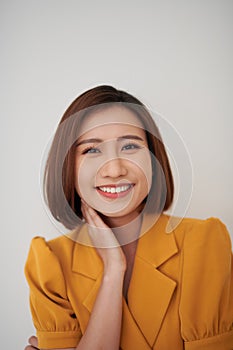 Close up portrait of a young woman with happy expression on face isolated on white background