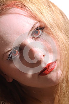 Close-up portrait young woman with red eyes photo