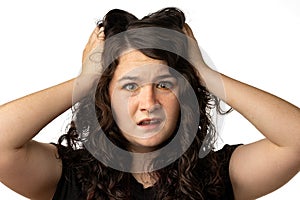 Close up portrait of young woman who is frustrated, on white background