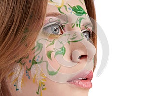 Close-up portrate of young girl witn faceart photo