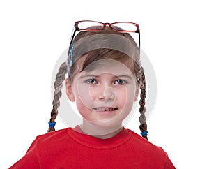 Close up portret of little girl with glasses on top of head photo