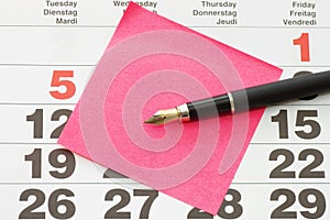 Close up of Post-It Note on Calendar