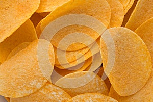 Close up potato chips on wood top view background.